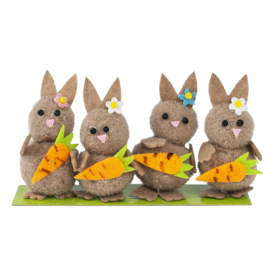 Un ensemble de lapins décoratifs avec des carottes