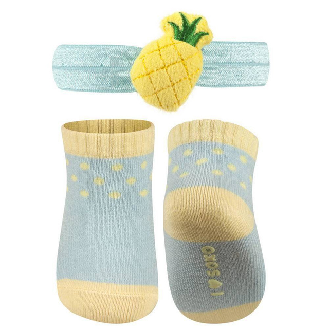 Un ensemble de chaussettes bébé SOXO bleues avec un bandeau à l'ananas